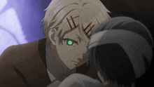 a man with a bandage on his head looks at another man