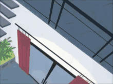 an aerial view of a balcony with a red curtain hanging from it