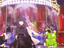 a girl in a black dress stands next to a girl in a pink dress