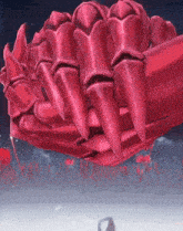 a giant red hand with sharp claws is flying in the sky