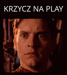 a picture of a man with his mouth open and the words krzycz na play below him