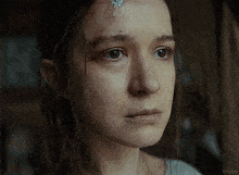 a woman with a bandage on her forehead looks at the camera with the caption kepler