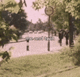 a blurry picture of a street with the words me and twin written on it