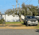 a ford escape is parked in a grassy area