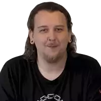 a man with long hair and a beard is wearing a black shirt