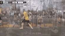 a group of people are playing soccer on a field with the words deportivo las heras written on the bottom