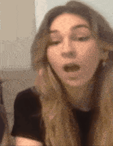 a close up of a woman making a funny face