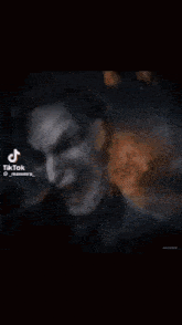 a tik tok video of a person 's face with a glowing circle around it
