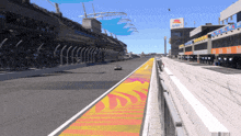 a race track with a red bull sign on the side