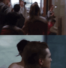 a blurred image of a crowd of people and a woman without a shirt