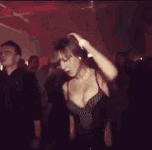 a blurry picture of a woman dancing in a dark room