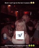 a woman in a white tank top with the letter v on her chest