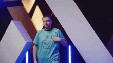 a man in a riyadh season jersey stands in front of a wall