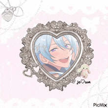a picture of a boy in a heart shaped frame with a tiffany heart necklace