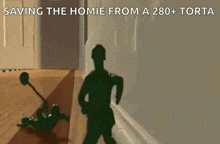 a toy soldier is standing next to another toy soldier on a wooden floor in a hallway .