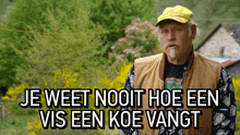 a man wearing a yellow hat and a vest says je weet nooit hoe een vis een koe vangt