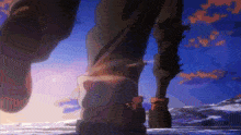 a close up of a person 's feet walking on a beach