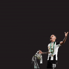 a soccer player holding a trophy with the words " we go onto the pitch as players we leave as f * cking legend "