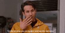 a man in a yellow jacket is saying i 'd like to strap you to my face