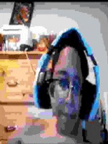 a pixel art of a man wearing headphones and glasses