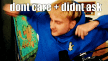 a man in a blue sweatshirt with the words " dont care + didnt ask " written above him