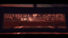 a car is driving down a road with trees on the side of the road .