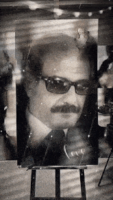 a painting of a man with a mustache and sunglasses