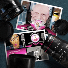 a camera lens sits on top of a stack of flyers for entrepreneur talks