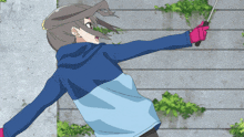 a girl in a blue jacket is holding a knife in her right hand
