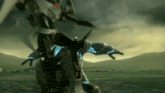 a robot is flying over a field with mountains in the background .