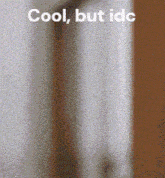 a blurred image of a door with the words cool but idc above it