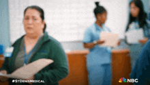 a blurry picture of nurses with the nbc logo in the upper right corner