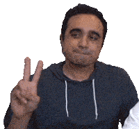 a man giving a peace sign with his fingers