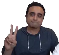 a man giving a peace sign with his fingers