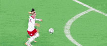 a soccer ball is being kicked in the air by a player