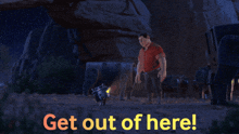 a man pointing at a dog with the words " get out of here " below him