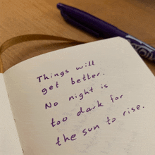 a purple pen sits next to a notebook that says things will get better no night is too dark for the sun to rise