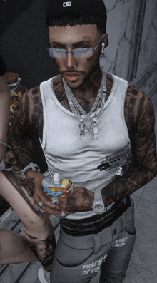 a man with a lot of tattoos is holding a bottle