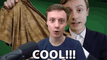 a man in a suit holds up a shirt with the words cool written on it