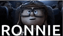 a cartoon character wearing a helmet and goggles is sitting in a theater with the name ronnie .