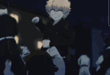 a man in a black jacket is smiling while holding another man 's arm