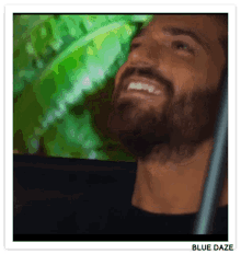 a man with a beard is smiling in a blue daze sticker
