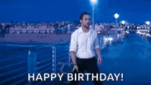 a man is standing on a pier with the words `` happy birthday '' written below him .
