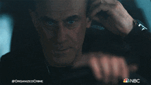 Fixing The Earpiece Detective Elliot Stabler GIF - Fixing The Earpiece Detective Elliot Stabler Christopher Meloni GIFs