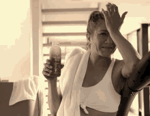 a woman holding a bottle of collagen water in her hand