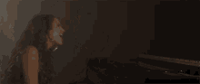 a blurred image of a woman 's face with her hair blowing in the wind
