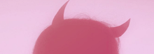 a close up of a person 's head with horns on it .