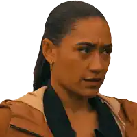a close up of a woman 's face with a ponytail