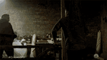 two men are fighting in a dark room with #chicagopd on the bottom