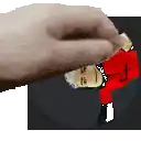 a hand is holding a picture of a man in a red jacket